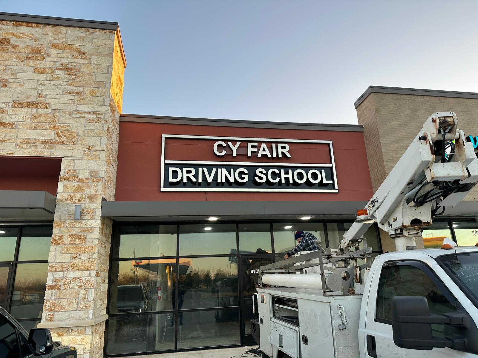 Driving school storefront sign by Sign Go