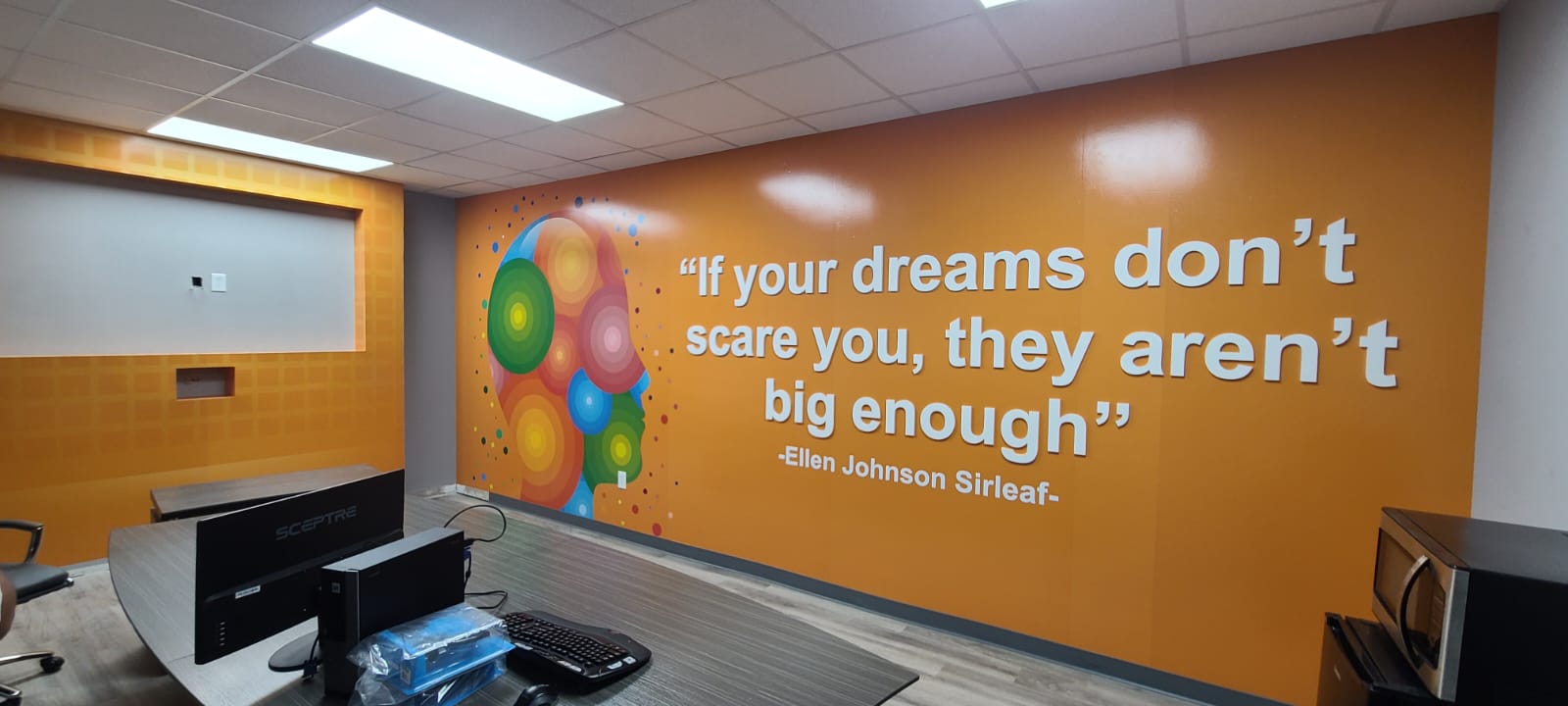 Interior wall wrap and sign installation by Sign Go