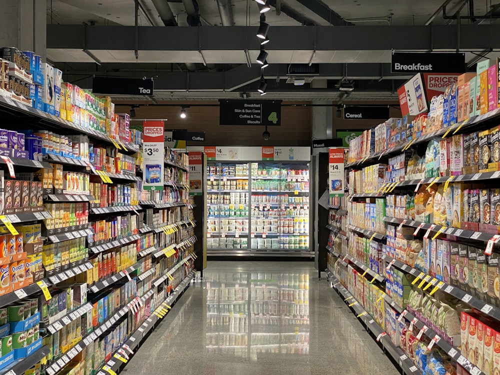 Retail store aisle markers and point-of-purchase signage